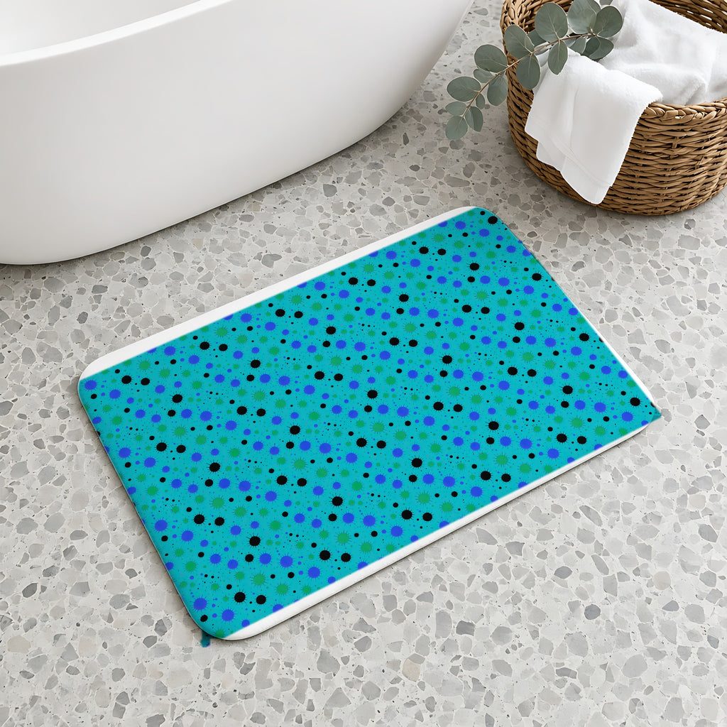 Blot Burst Bath Mat on a terrazzo floor beside a freestanding bath