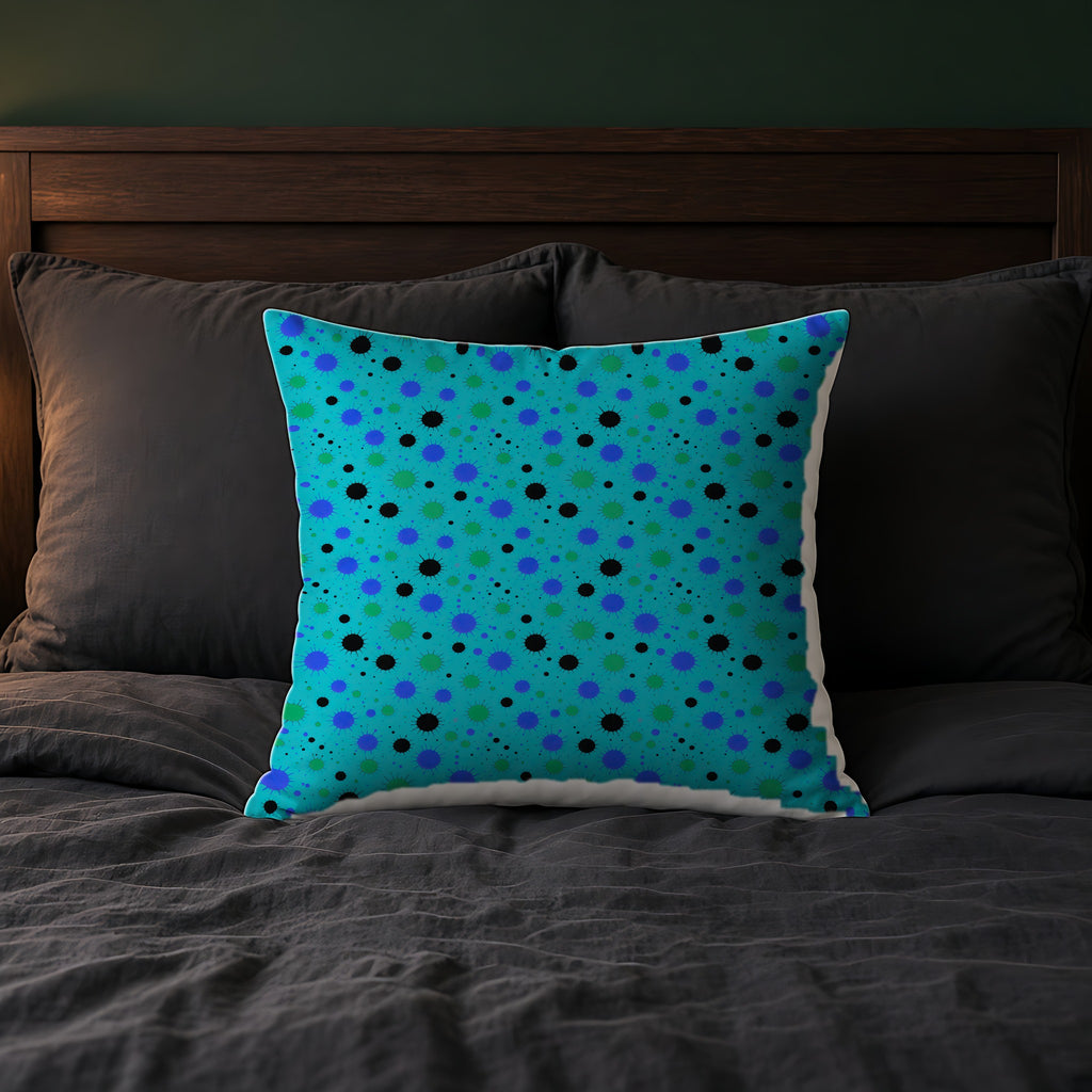 Blot Burst Faux Suede Cushion on a bed with charcoal bedding