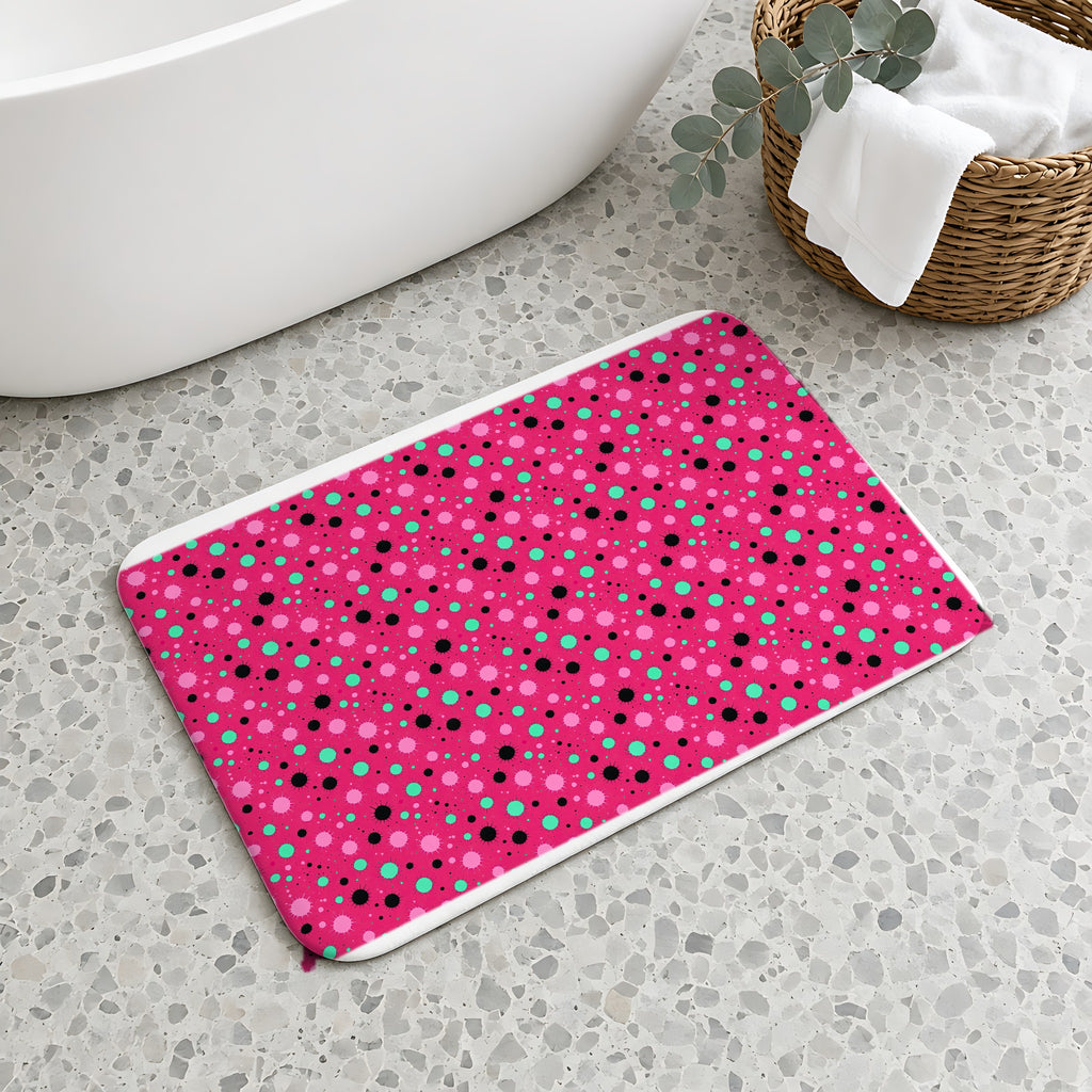 Blot Burst Bath Mat on a terrazzo floor beside a freestanding bath