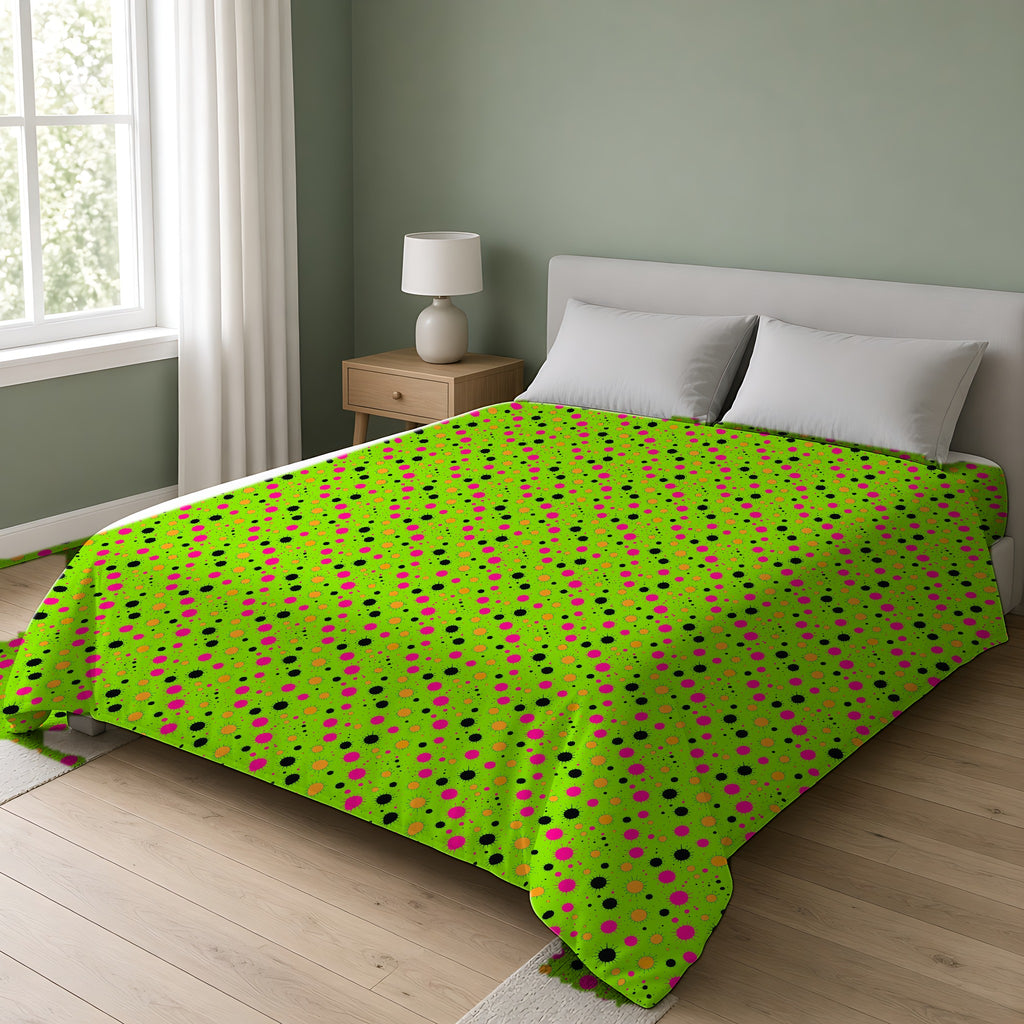 Blot Burst Cotton Duvet Cover on a double bed in a bright sage-green bedroom
