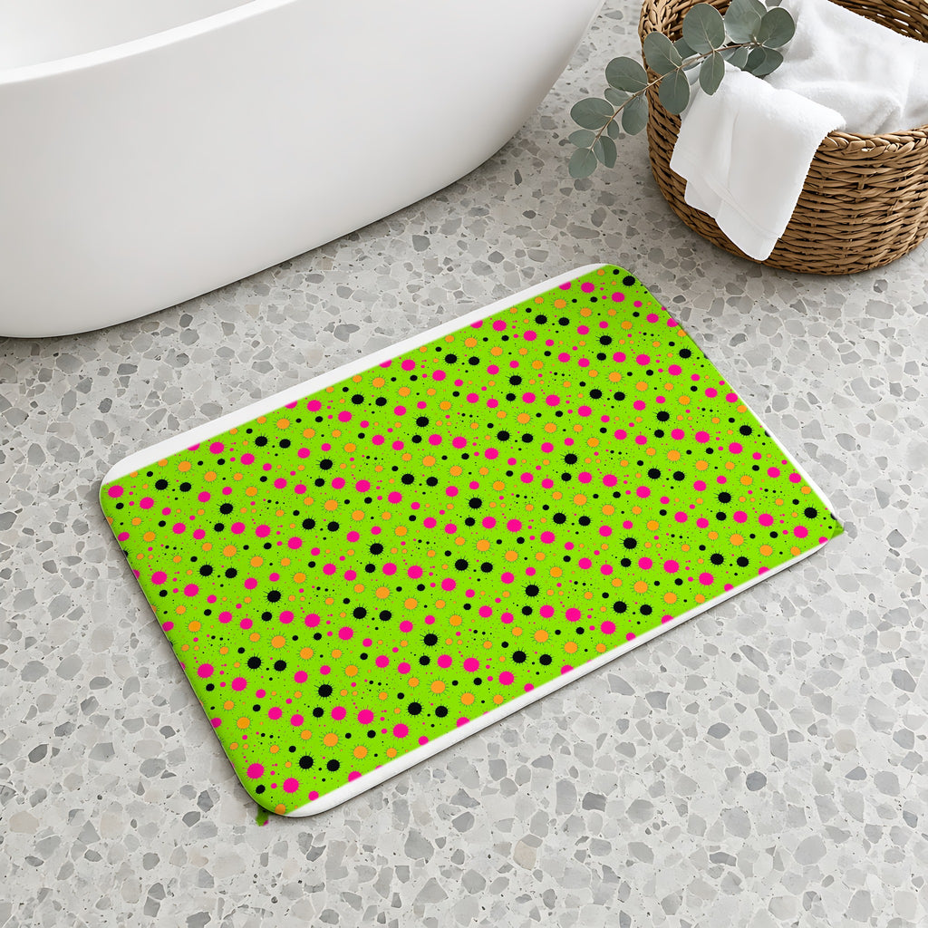 Blot Burst Bath Mat on a terrazzo floor beside a freestanding bath