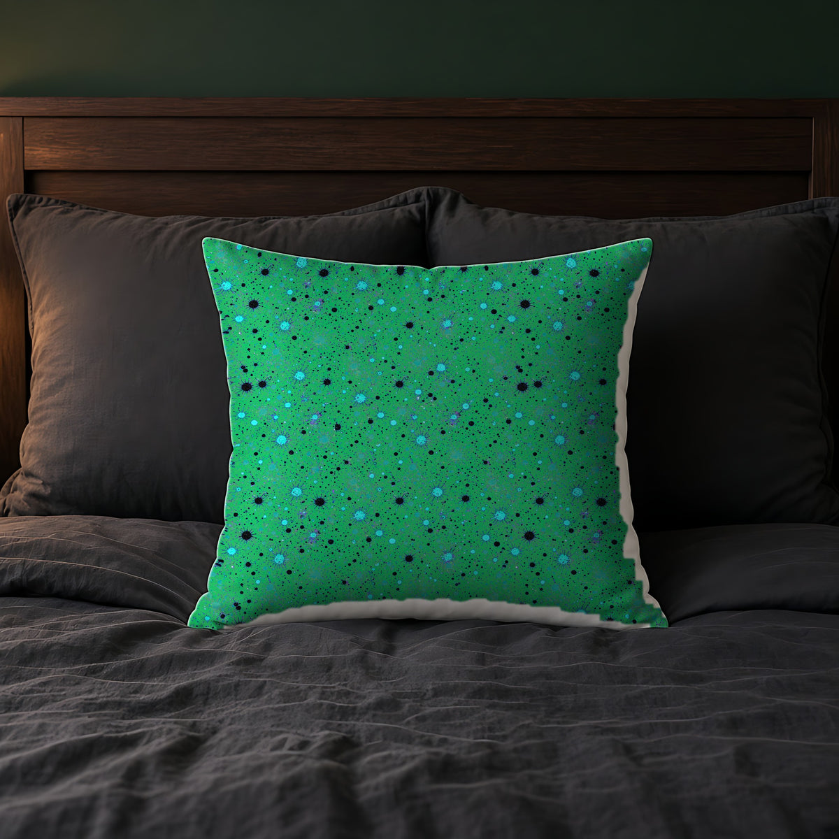 Spray Field Faux Suede Cushion on a bed with charcoal bedding