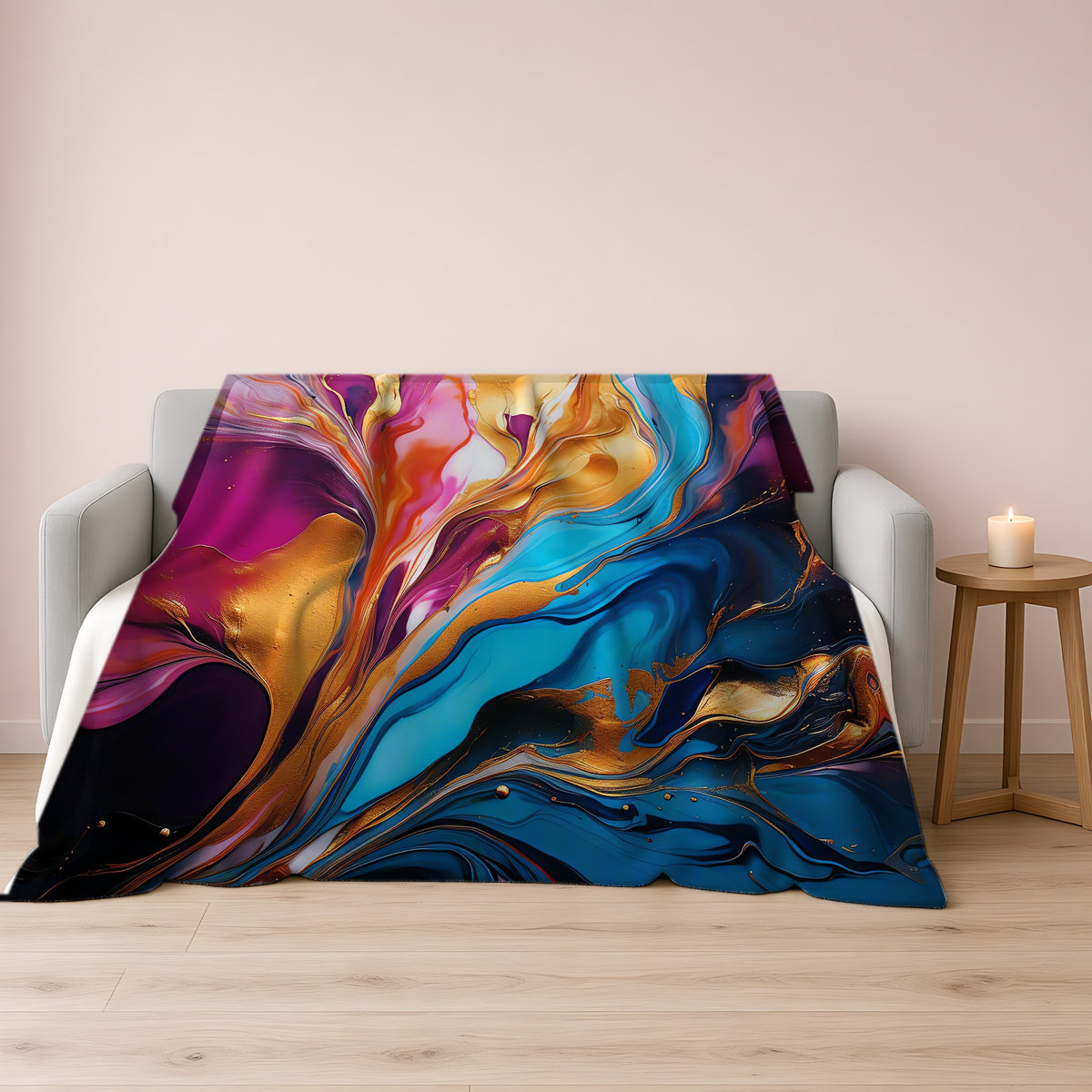Gilded Fluid Swirl Sherpa Fleece Blanket draped over a grey sofa