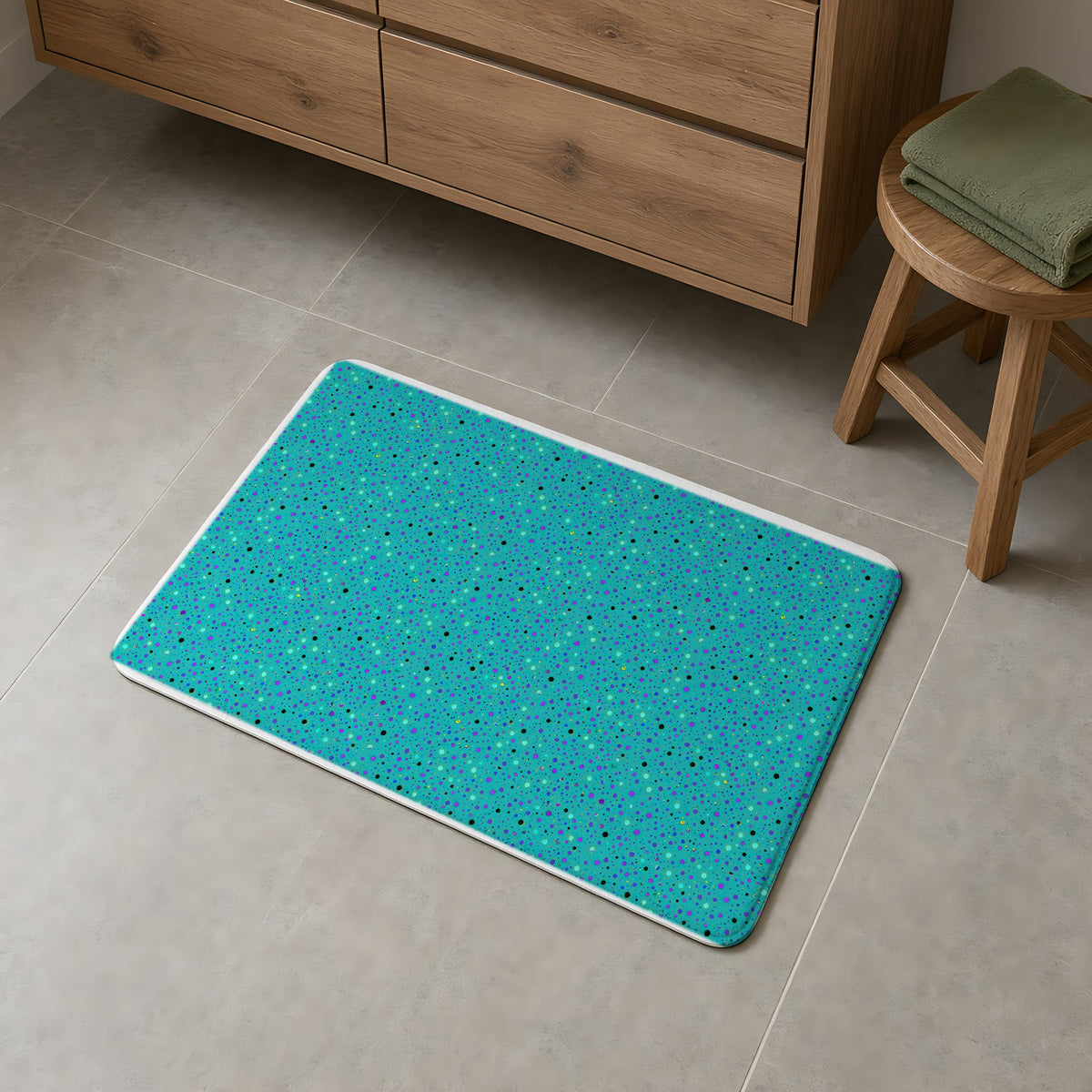 Confetti Spatter Bath Mat on a grey tiled bathroom floor