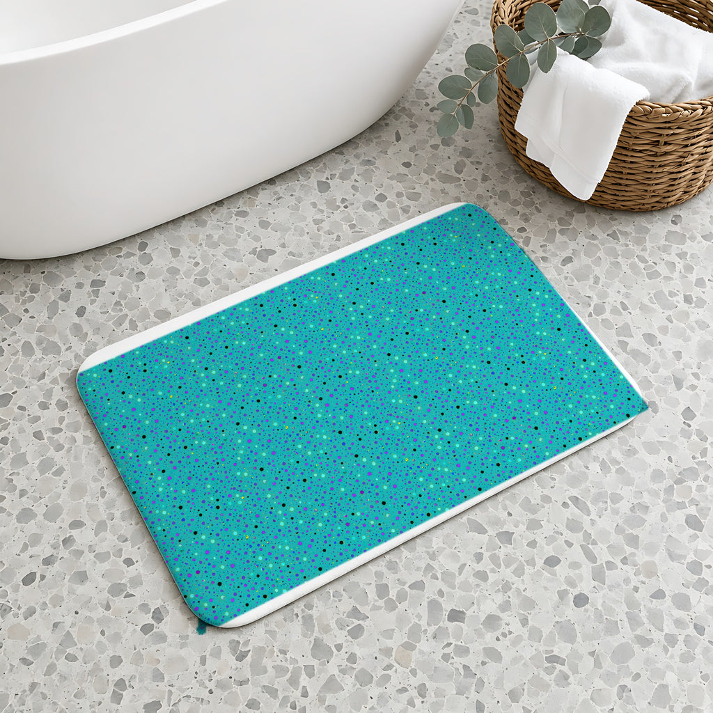 Confetti Spatter Bath Mat on a terrazzo floor beside a freestanding bath