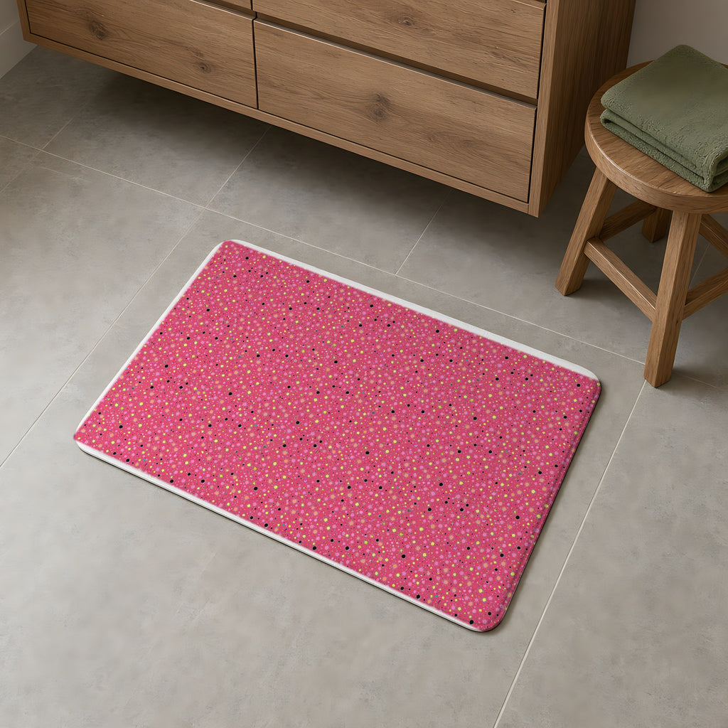 Confetti Spatter Bath Mat on a grey tiled bathroom floor