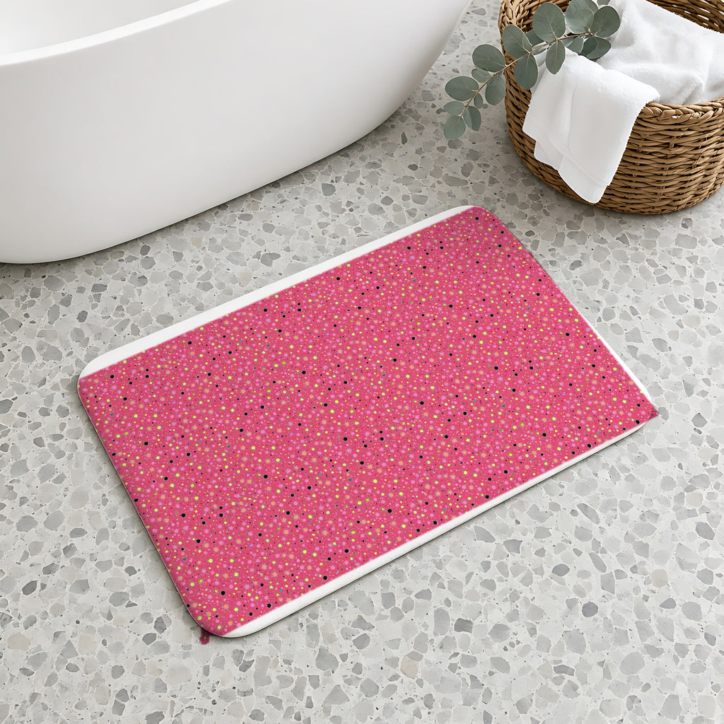 Confetti Spatter Bath Mat on a terrazzo floor beside a freestanding bath