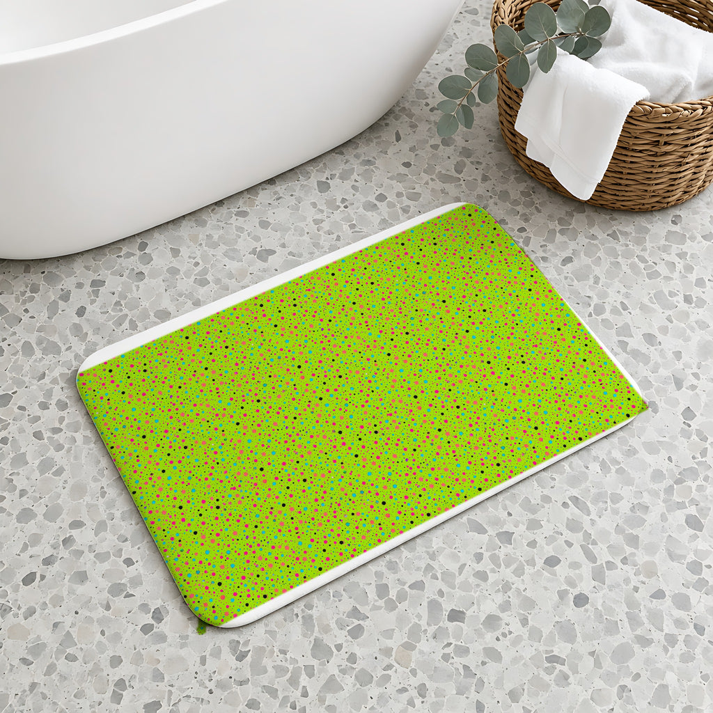 Confetti Spatter Bath Mat on a terrazzo floor beside a freestanding bath