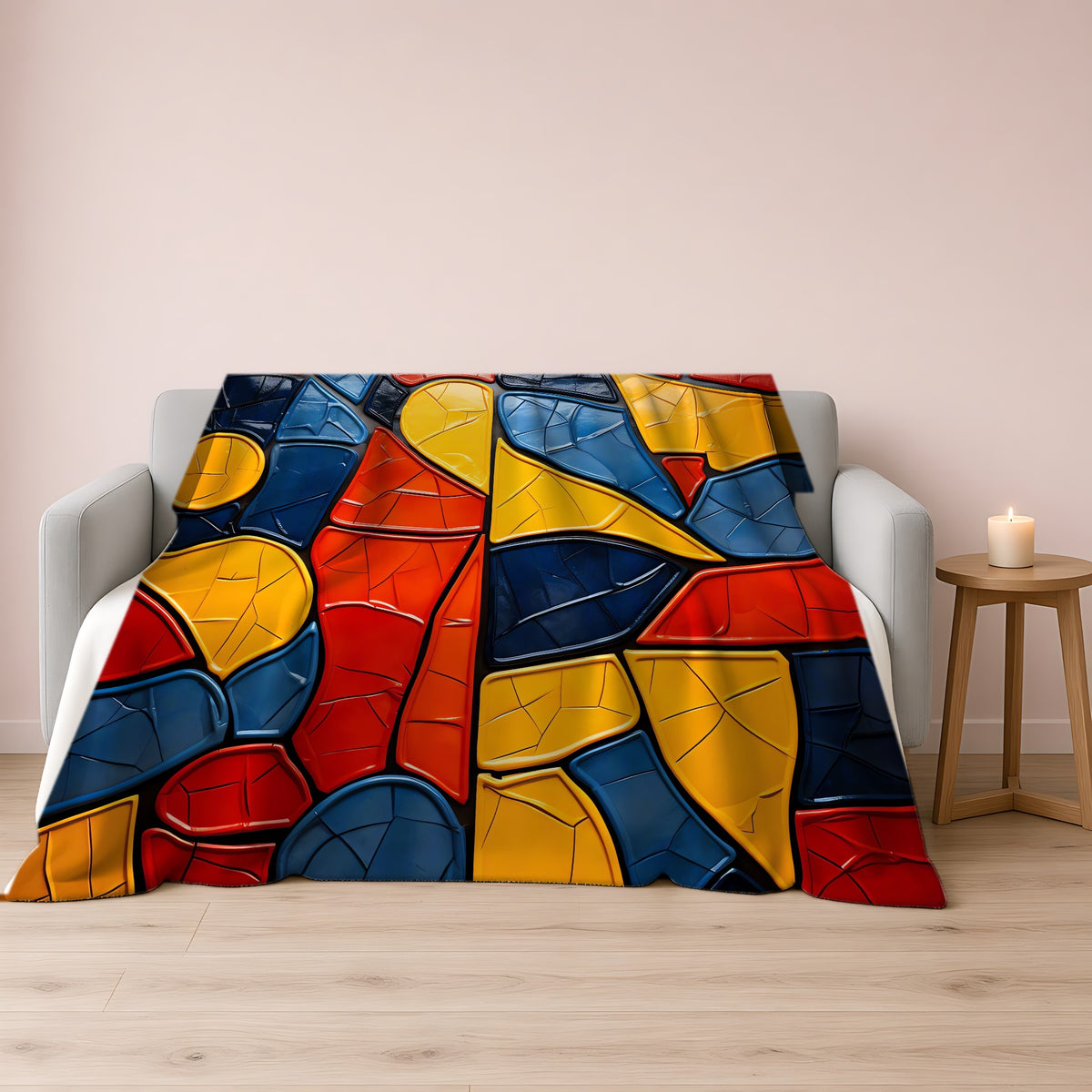 Bold Mosaic Glass Sherpa Fleece Blanket draped over a grey sofa