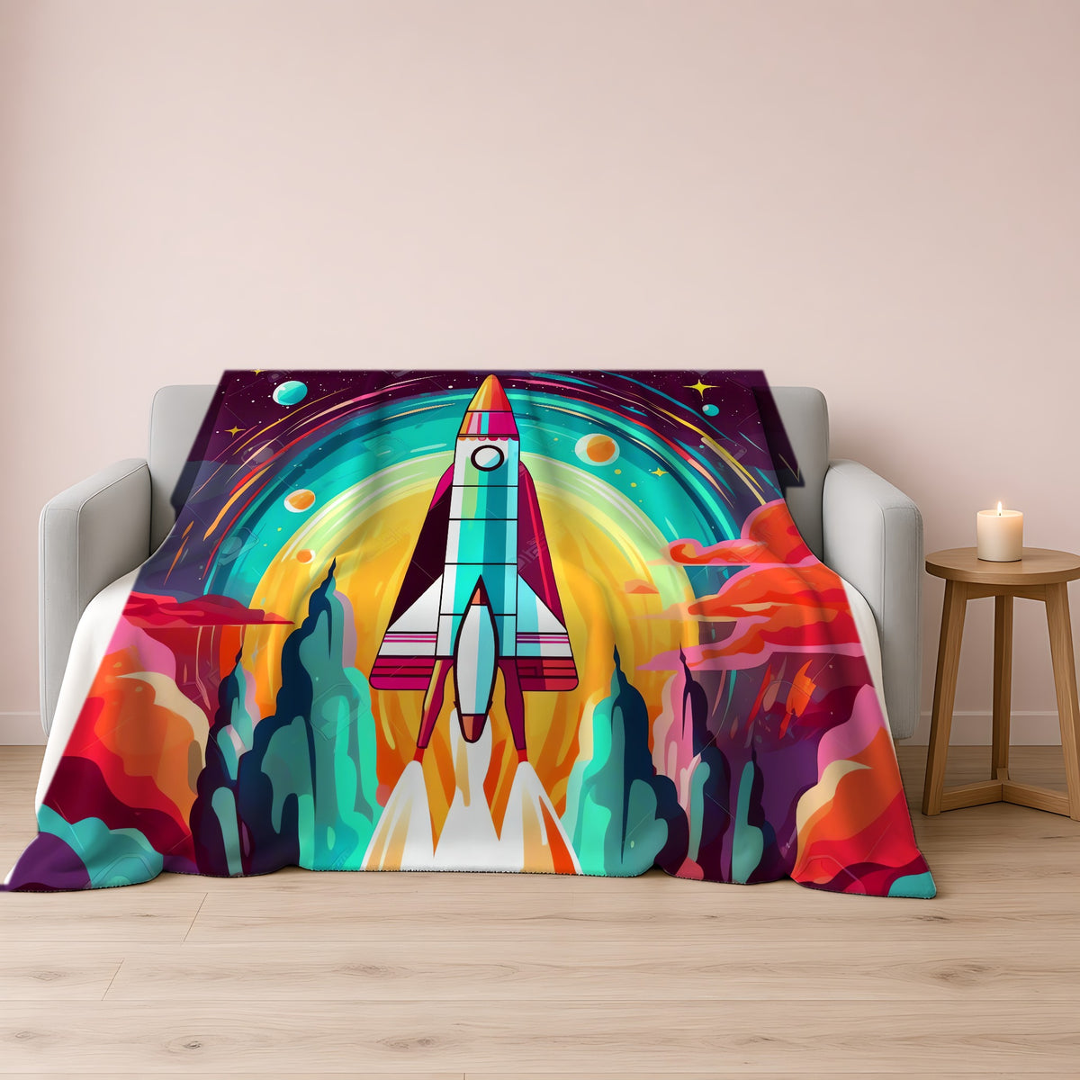 Retro Rocket Launch Sherpa Fleece Blanket draped over a grey sofa