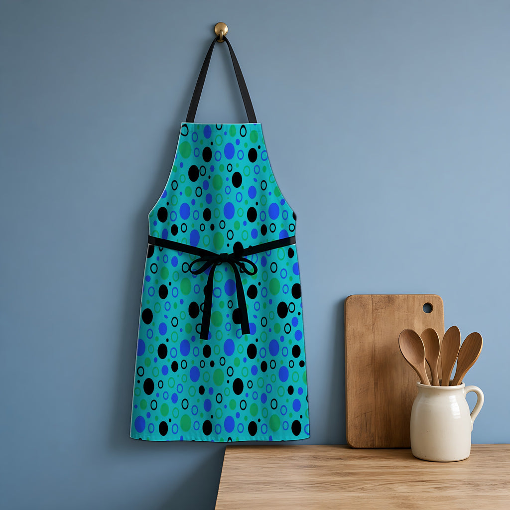 Bubble Outlines Apron hanging in a blue kitchen