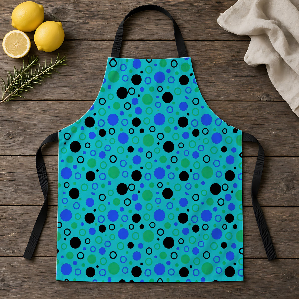Bubble Outlines Apron laid flat on a rustic wooden table