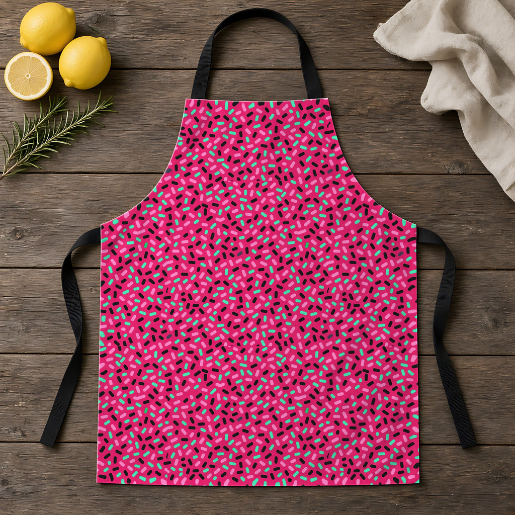 Sprinkle Pop Apron laid flat on a rustic wooden table