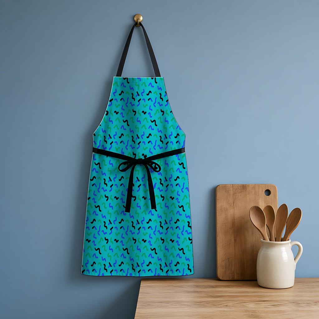 Squiggle Strokes Apron hanging in a blue kitchen