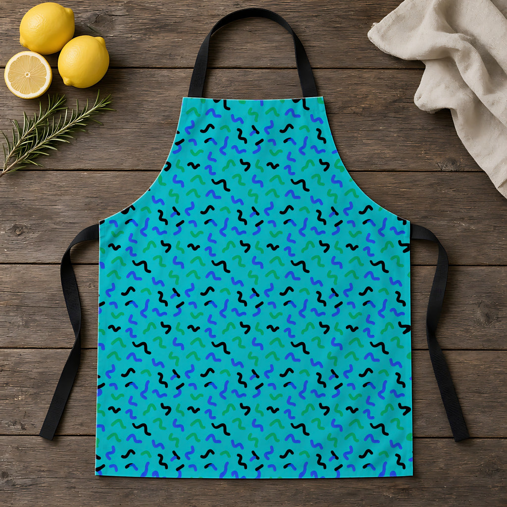 Squiggle Strokes Apron laid flat on a rustic wooden table
