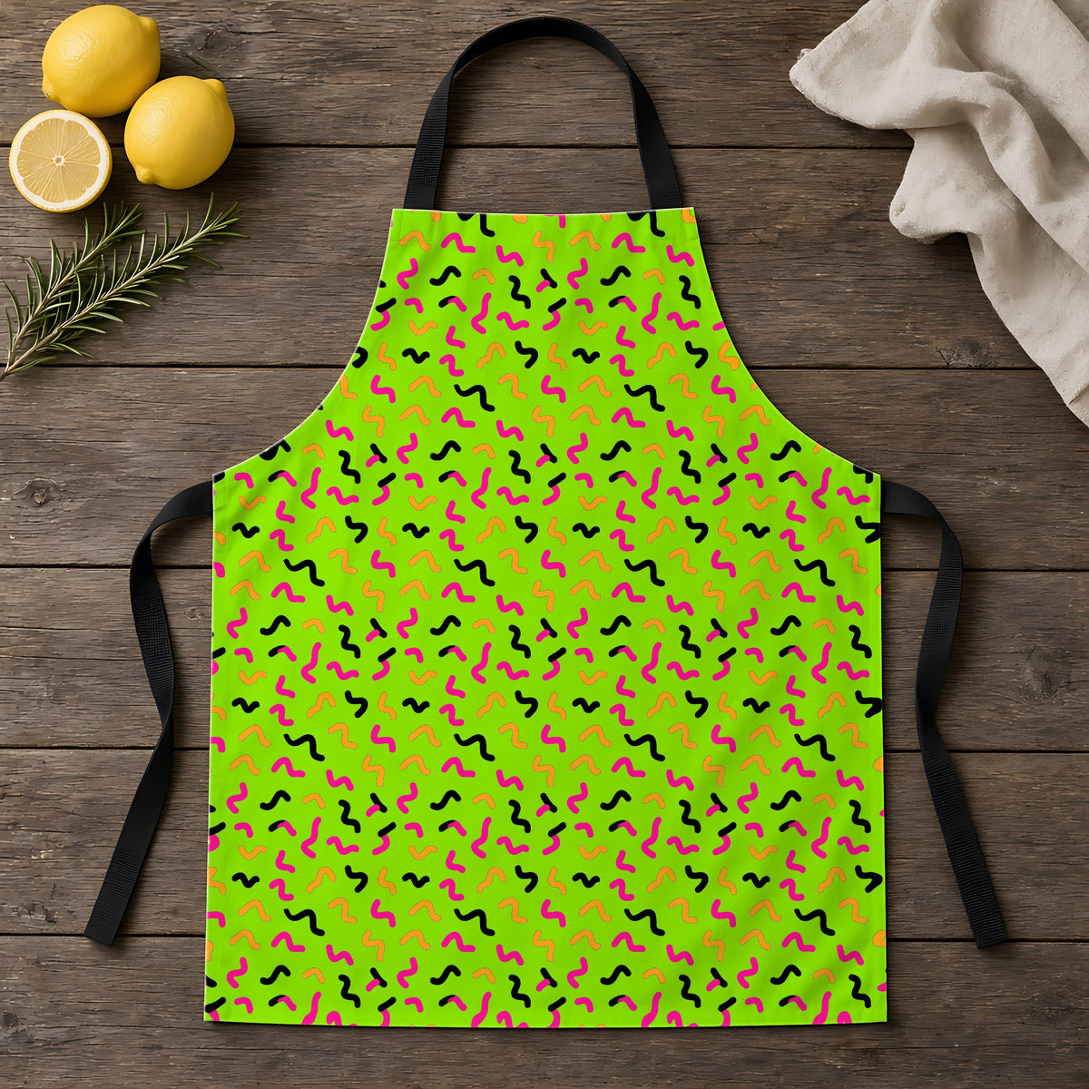 Squiggle Strokes Apron laid flat on a rustic wooden table