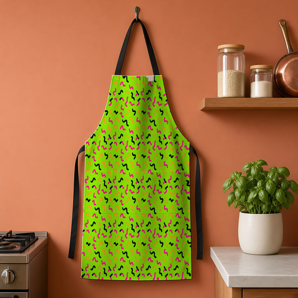 Squiggle Strokes Apron hanging on a terracotta kitchen wall