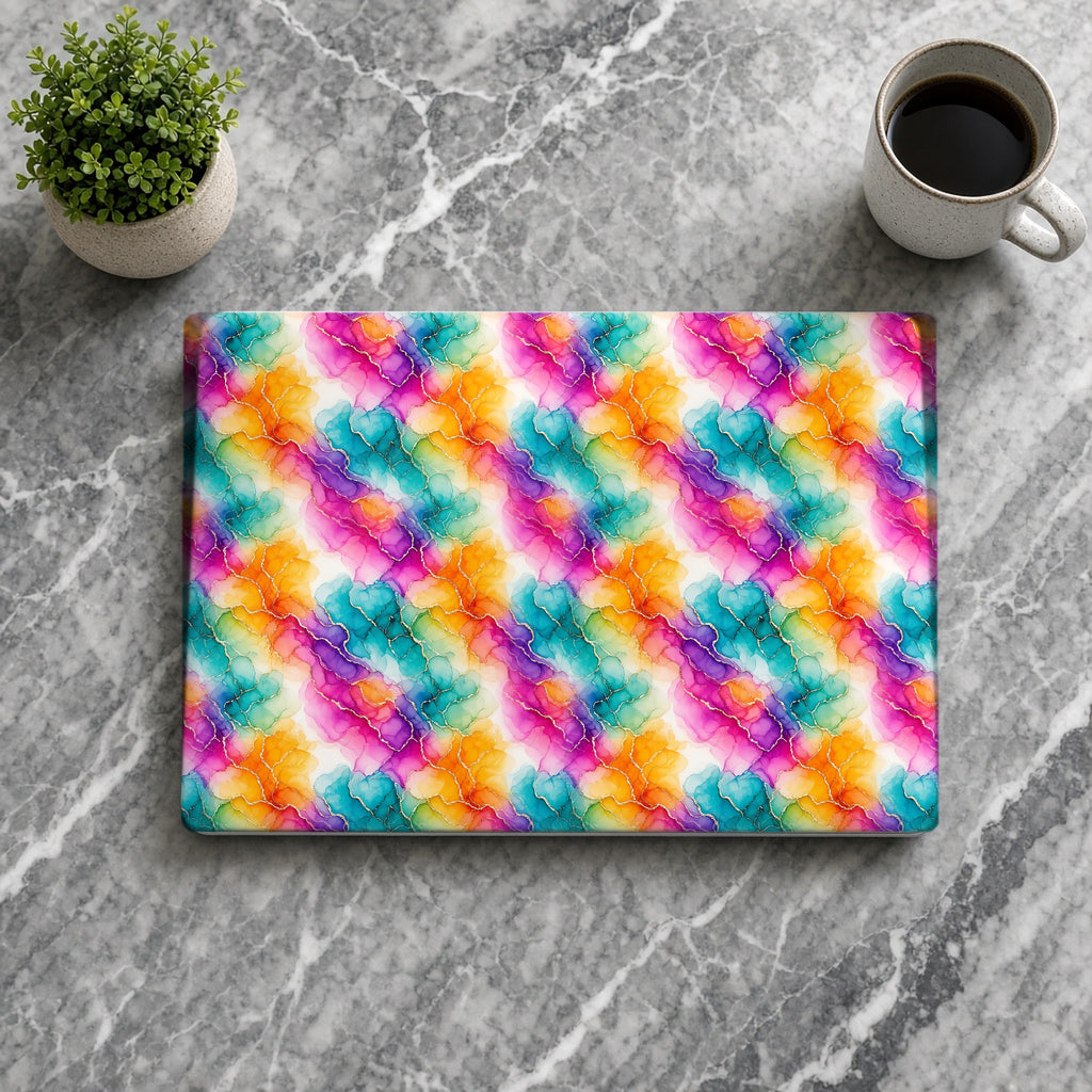 Rainbow Alcohol Ink Bloom matte MacBook case from above on grey marble with coffee
