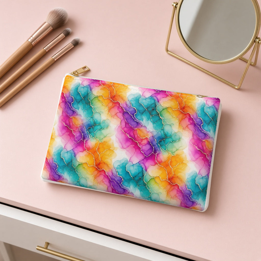 Rainbow Alcohol Ink Bloom zip accessory pouch on a pink dressing table with makeup brushes