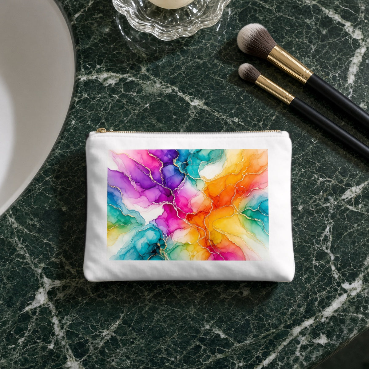 Rainbow Alcohol Ink Bloom canvas cosmetic bag on a green marble vanity