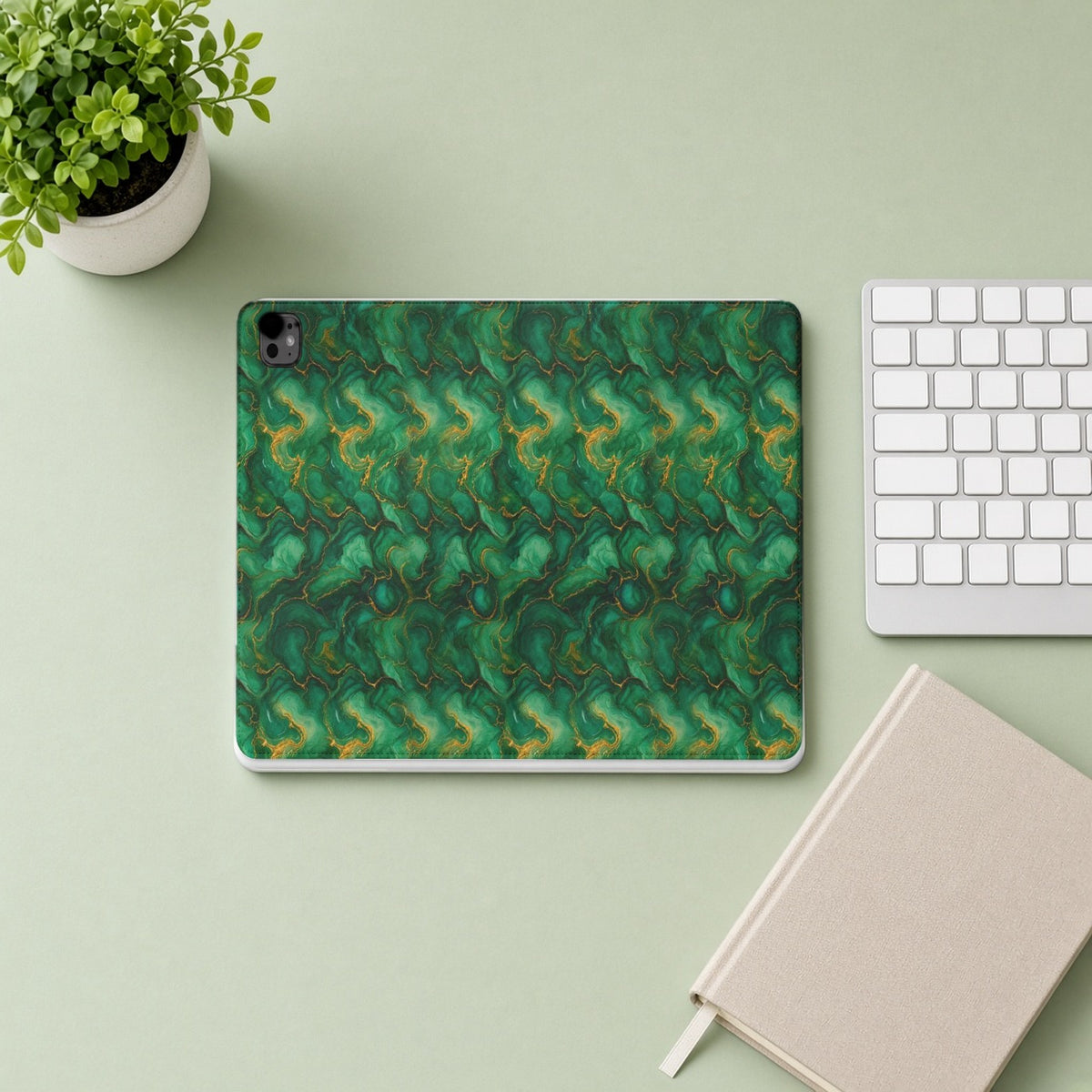 Emerald Tide-Pool Pour iPad folio case from above on a sage desk with a keyboard and notebook