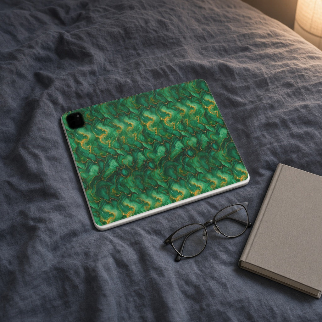 Emerald Tide-Pool Pour iPad folio case on slate-blue bedding with a book and glasses