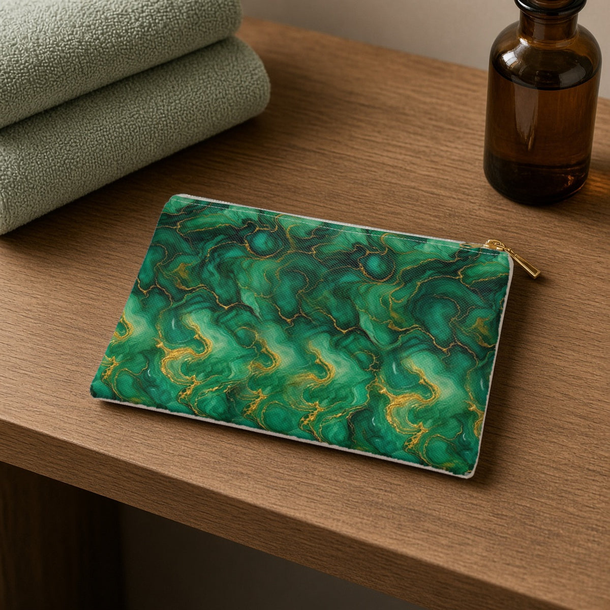 Emerald Tide-Pool Pour zip accessory pouch on a wooden shelf with towels and an amber bottle