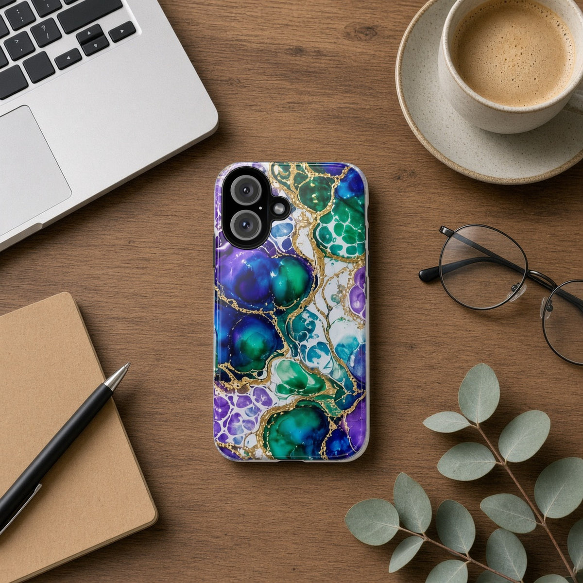 Peacock Acrylic Pour Cells tough phone case on a wooden desk beside a laptop, coffee and eucalyptus