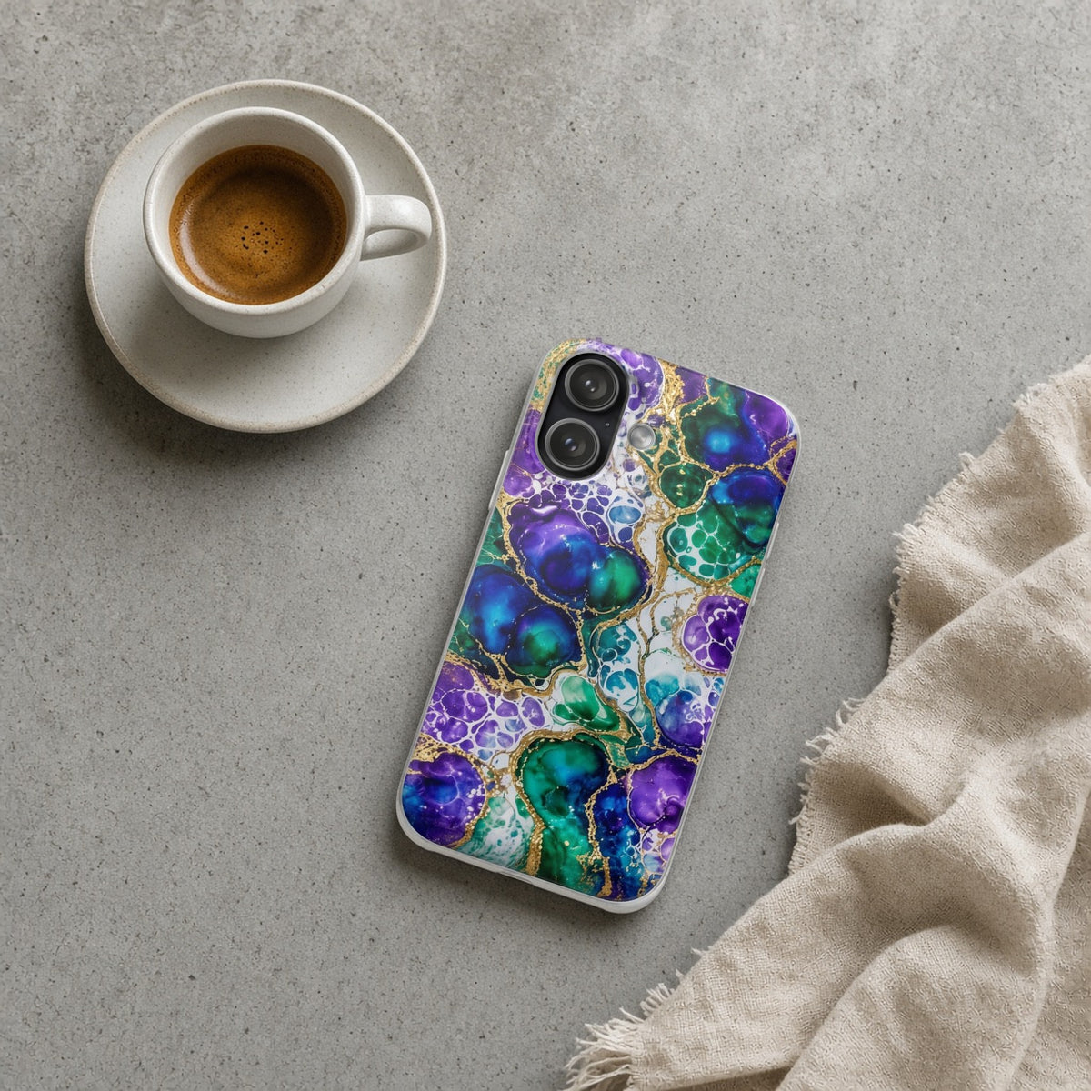Peacock Acrylic Pour Cells flexi phone case on a concrete cafe table with an espresso