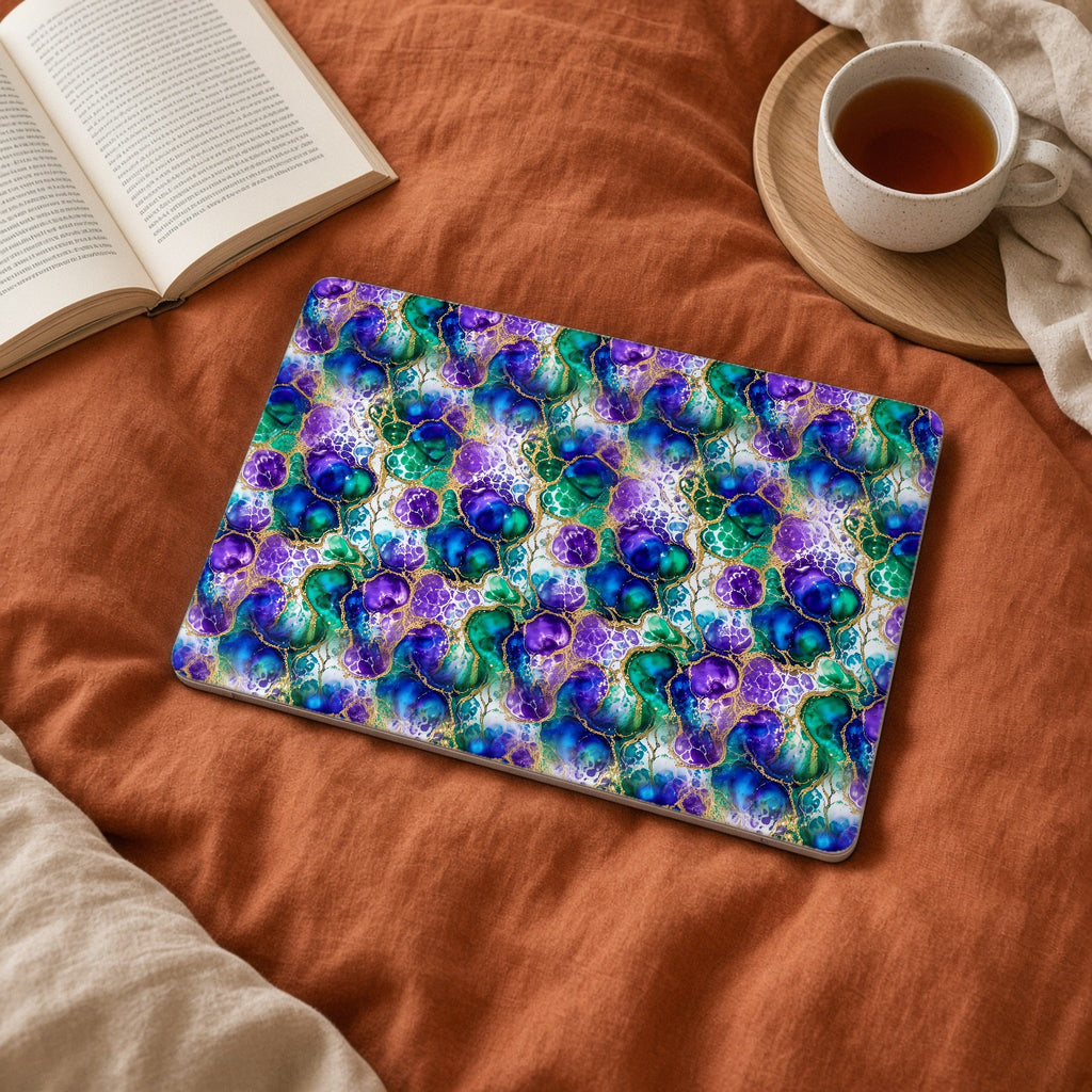 Peacock Acrylic Pour Cells matte MacBook case on a laptop on rust linen bedding