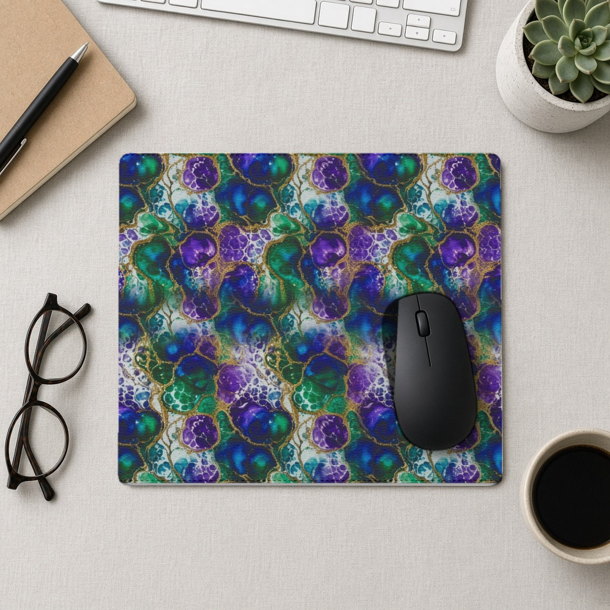 Peacock Acrylic Pour Cells vegan leather mouse mat from above with a mouse, notebook and glasses