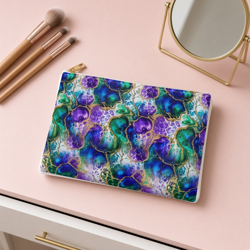 Peacock Acrylic Pour Cells zip accessory pouch on a pink dressing table with makeup brushes