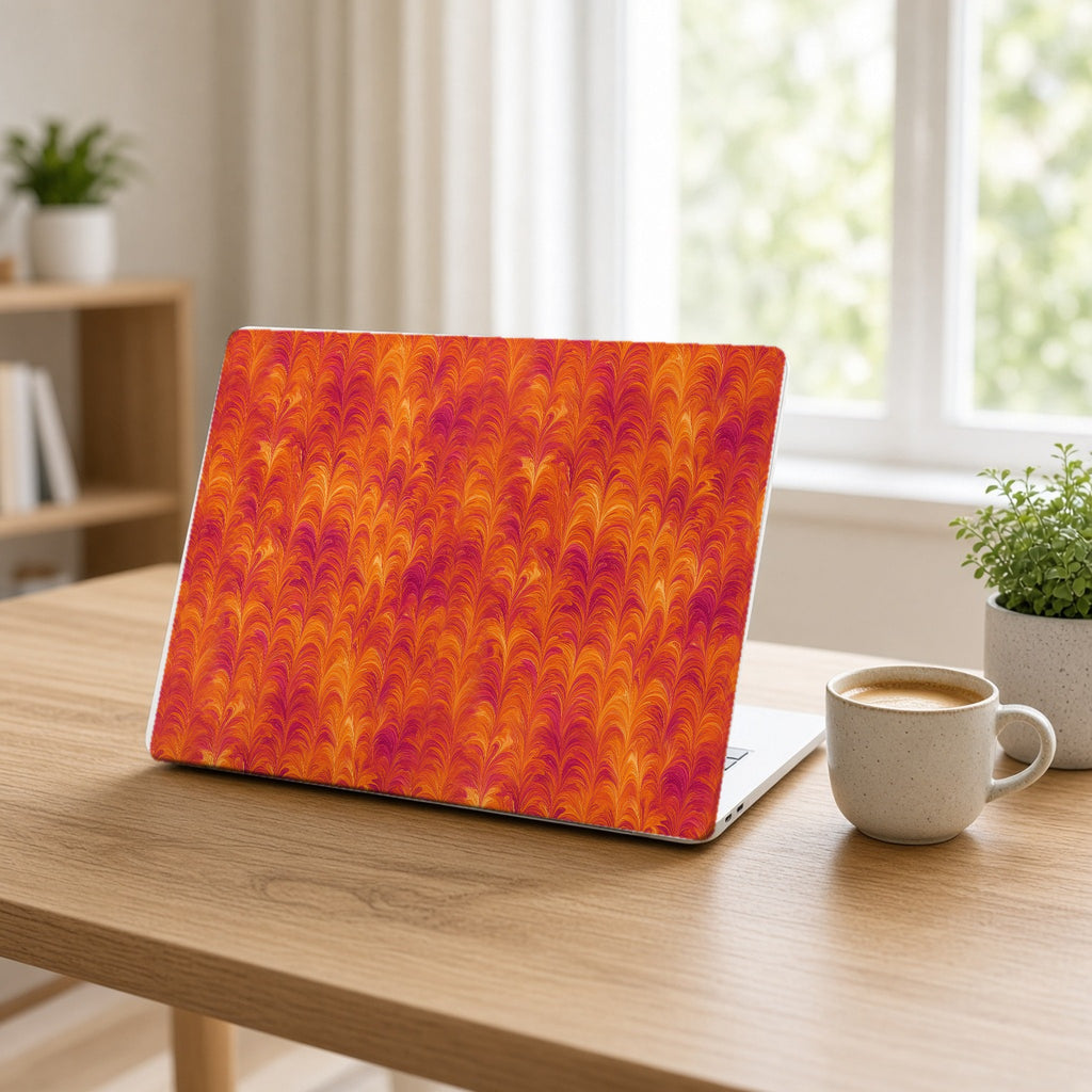 Sunset Feather Marbling matte MacBook case on an open laptop at a home office desk