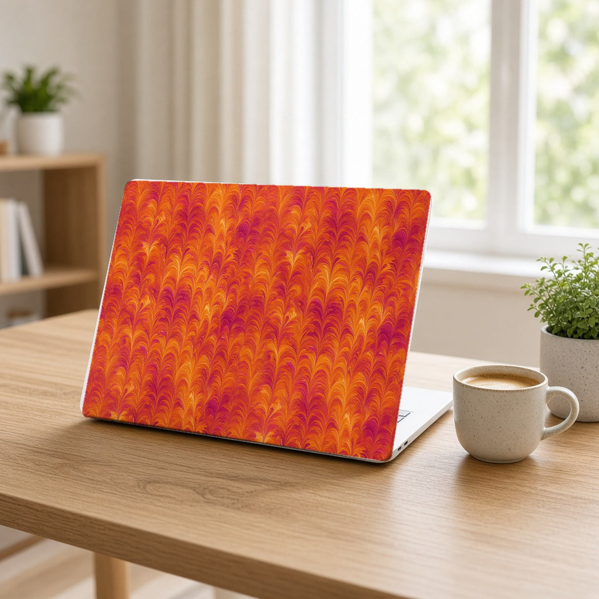 Sunset Feather Marbling matte MacBook case on an open laptop at a home office desk