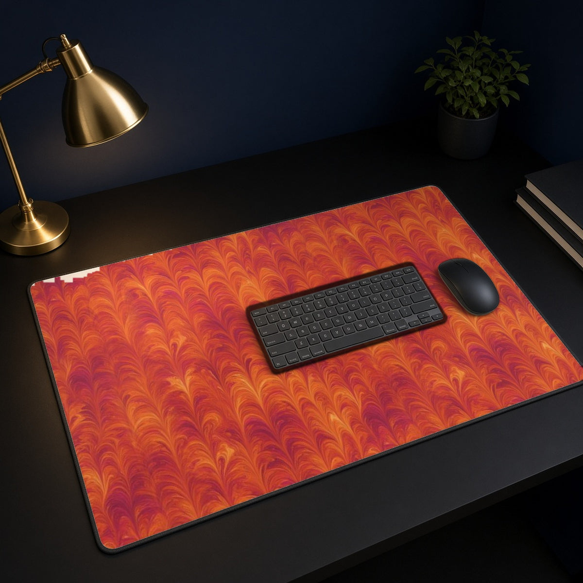 Sunset Feather Marbling desk mat on a black desk with a keyboard, mouse and brass lamp