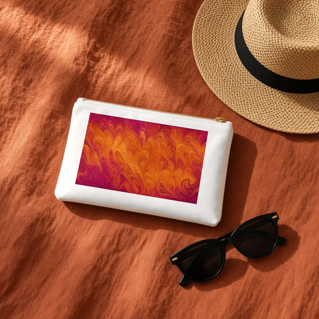 Sunset Feather Marbling canvas cosmetic bag on terracotta linen with a sun hat and sunglasses