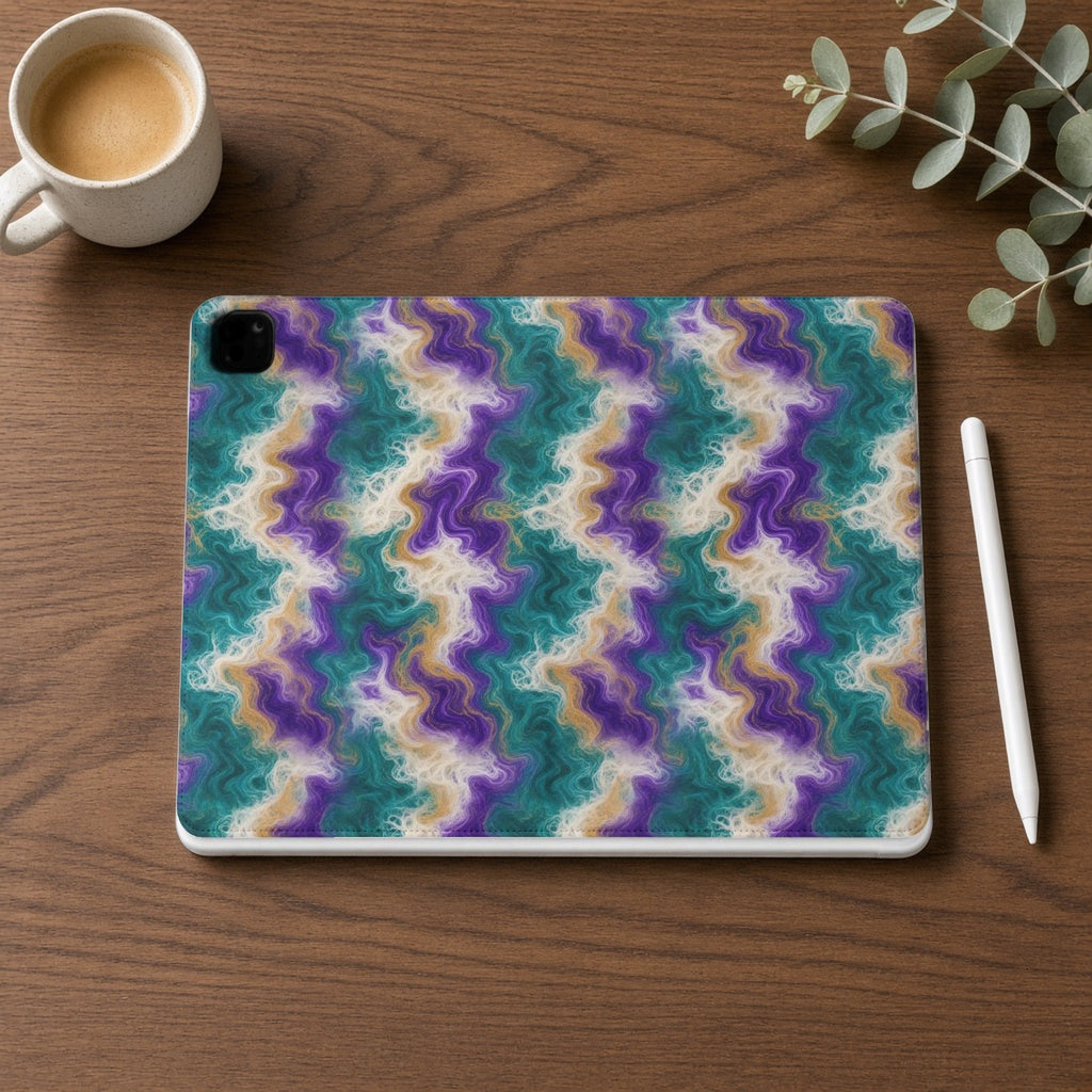 Peacock Resin Wave iPad folio case on a walnut desk with a stylus and coffee