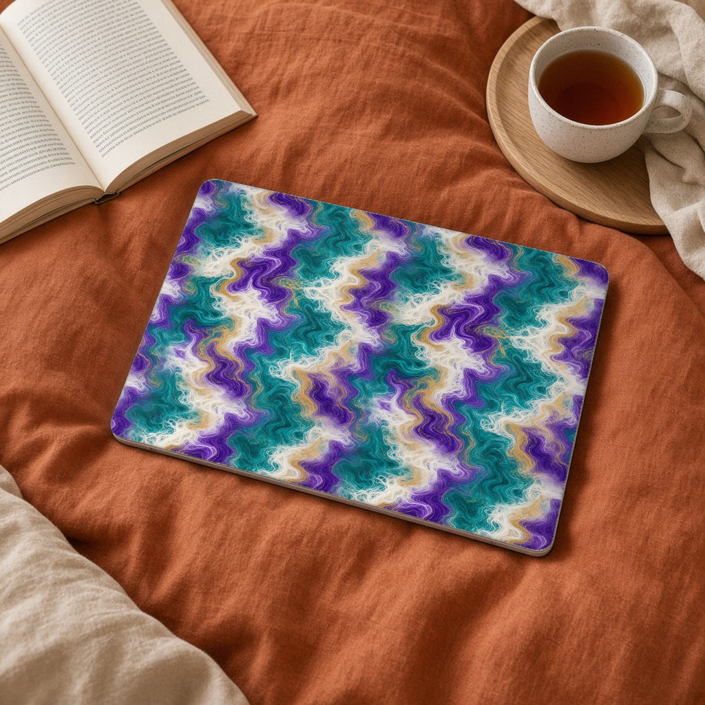 Peacock Resin Wave matte MacBook case on a laptop on rust linen bedding