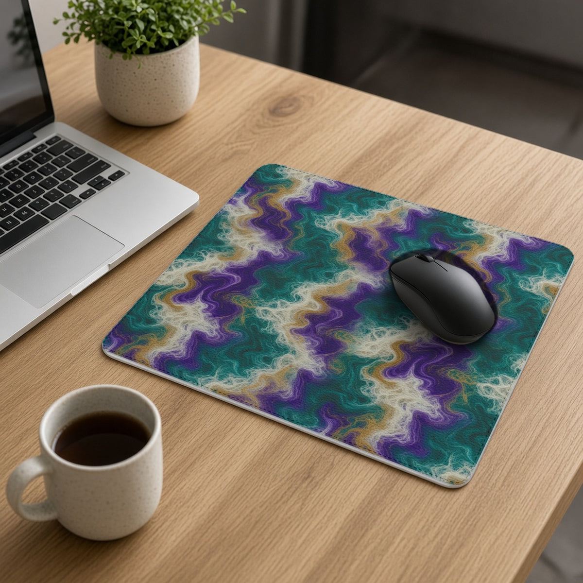 Peacock Resin Wave vegan leather mouse mat on an oak desk with a laptop, mouse and coffee