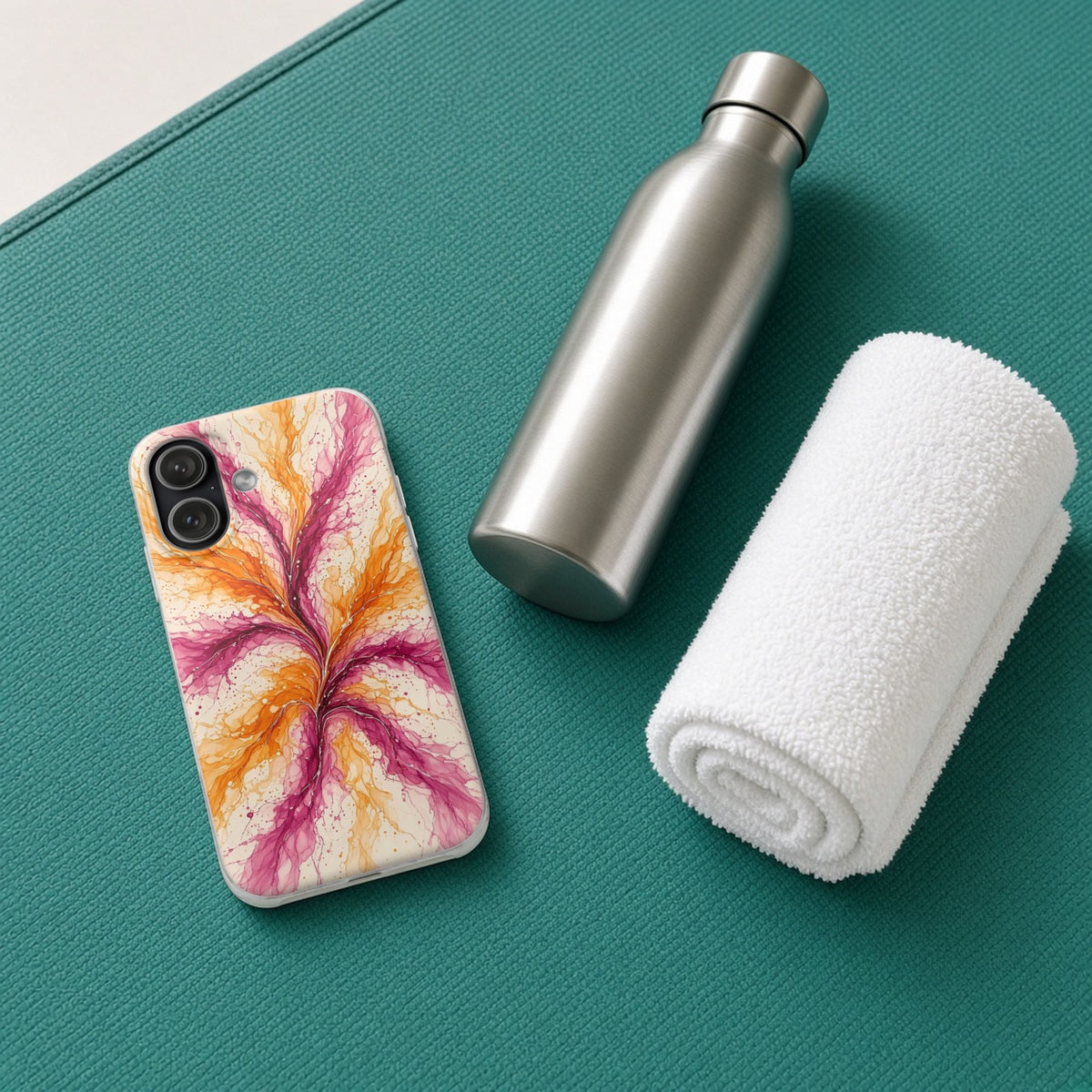 Sunset Ink Branches flexi phone case on a teal yoga mat with a water bottle and towel
