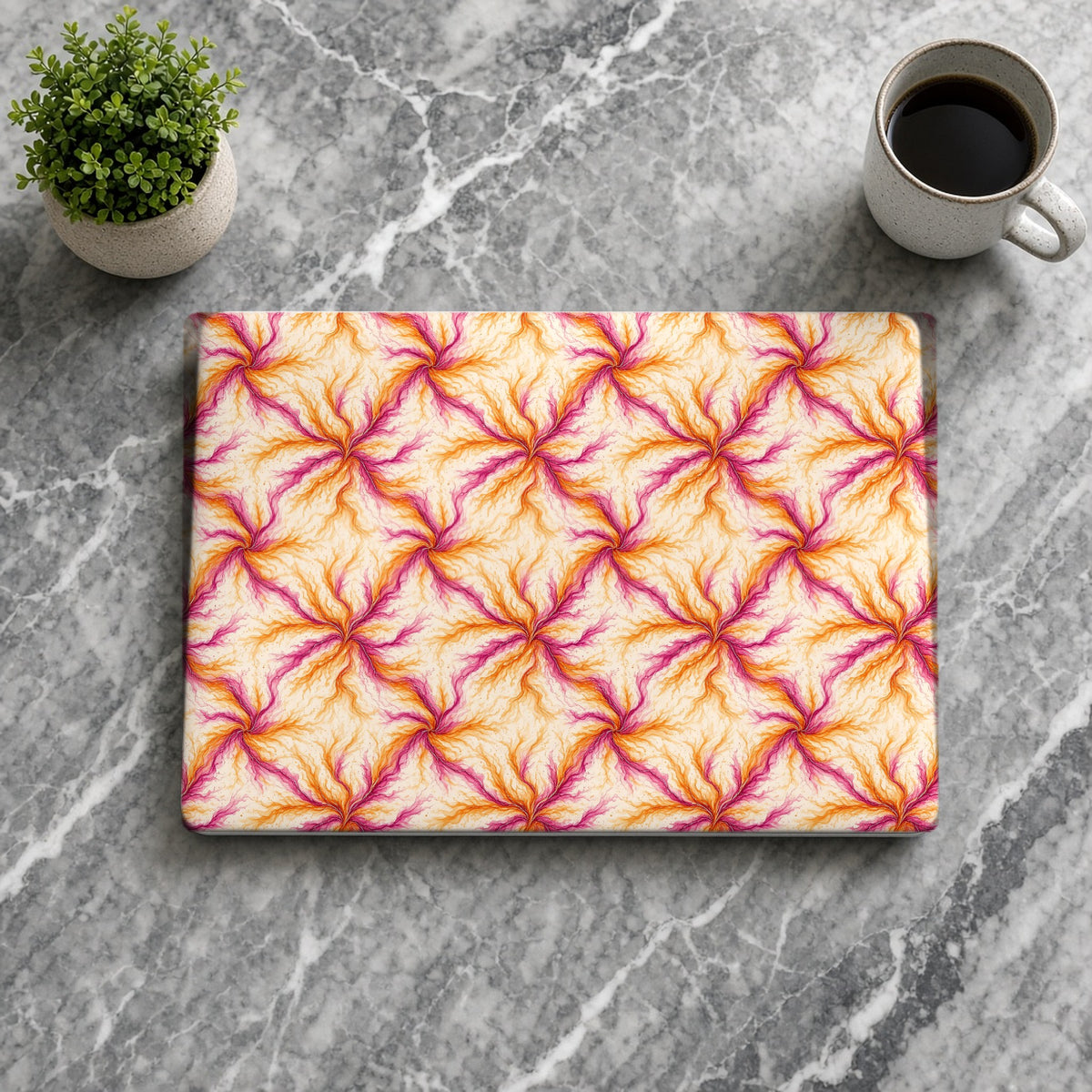 Sunset Ink Branches matte MacBook case from above on grey marble with coffee