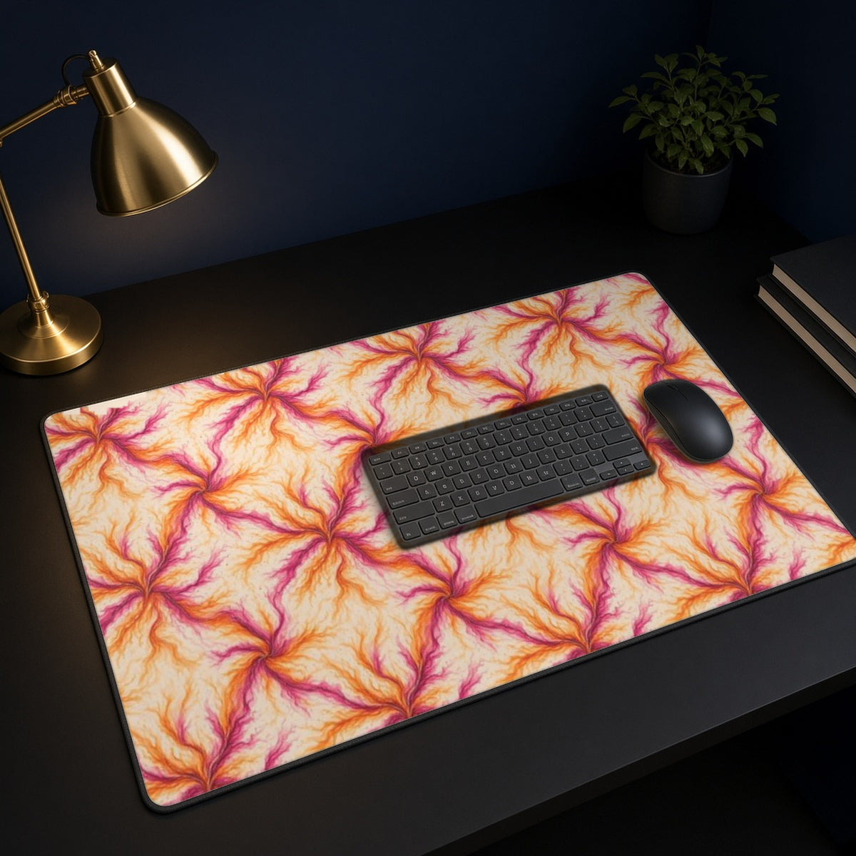 Sunset Ink Branches desk mat on a black desk with a keyboard, mouse and brass lamp