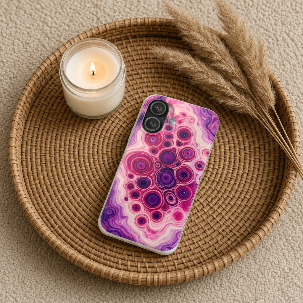 Berry Puddle Pour flexi phone case on a rattan tray with a candle and dried grasses