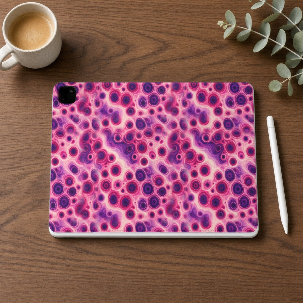 Berry Puddle Pour iPad folio case on a walnut desk with a stylus and coffee