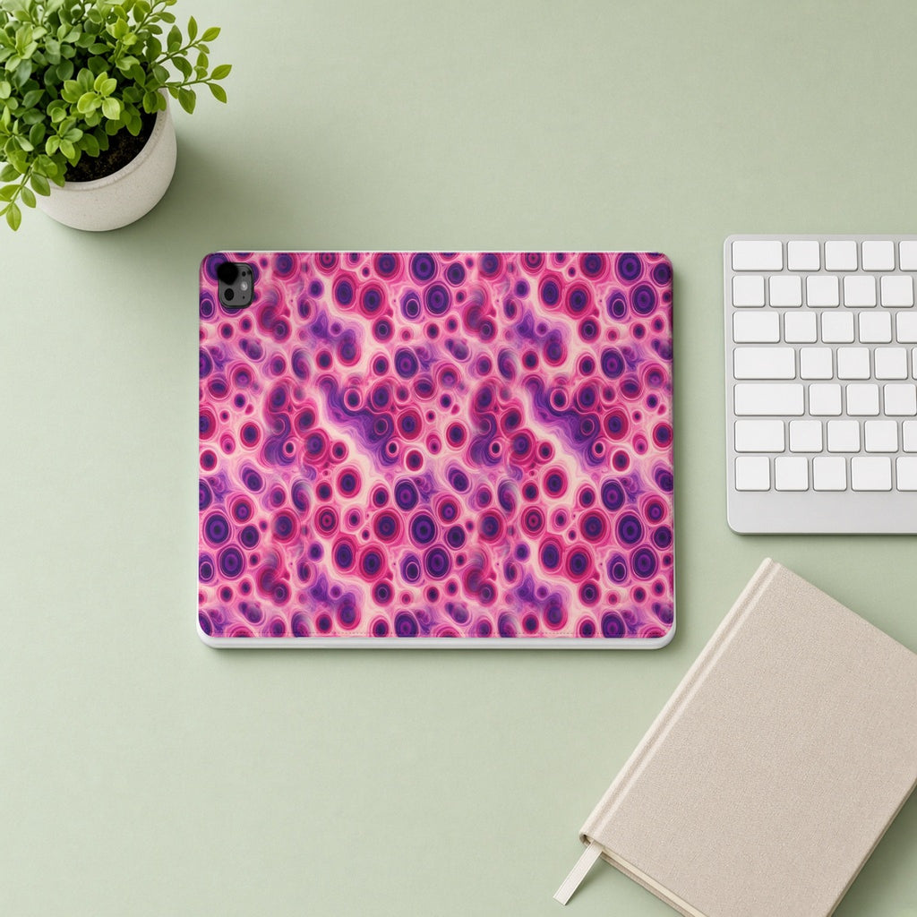 Berry Puddle Pour iPad folio case from above on a sage desk with a keyboard and notebook