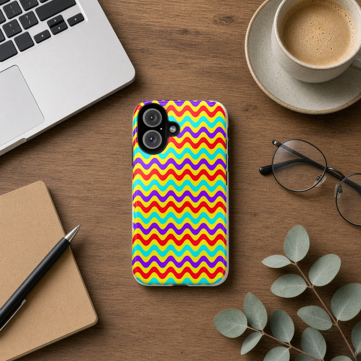 Big Ripple Chevrons tough phone case on a wooden desk beside a laptop, coffee and eucalyptus