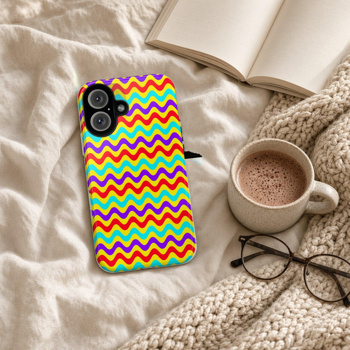Big Ripple Chevrons tough phone case on a cosy knit blanket with a hot chocolate and glasses