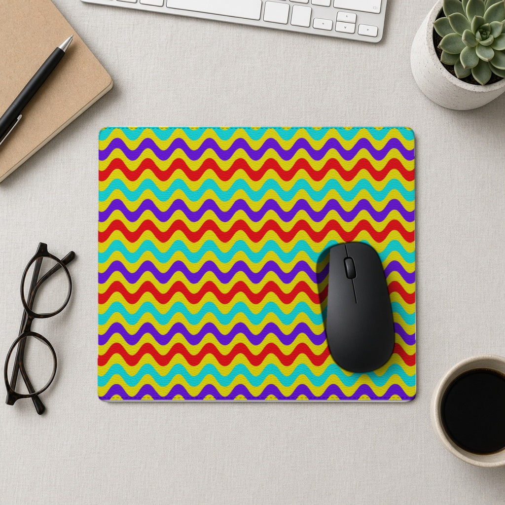 Big Ripple Chevrons vegan leather mouse mat from above with a mouse, notebook and glasses