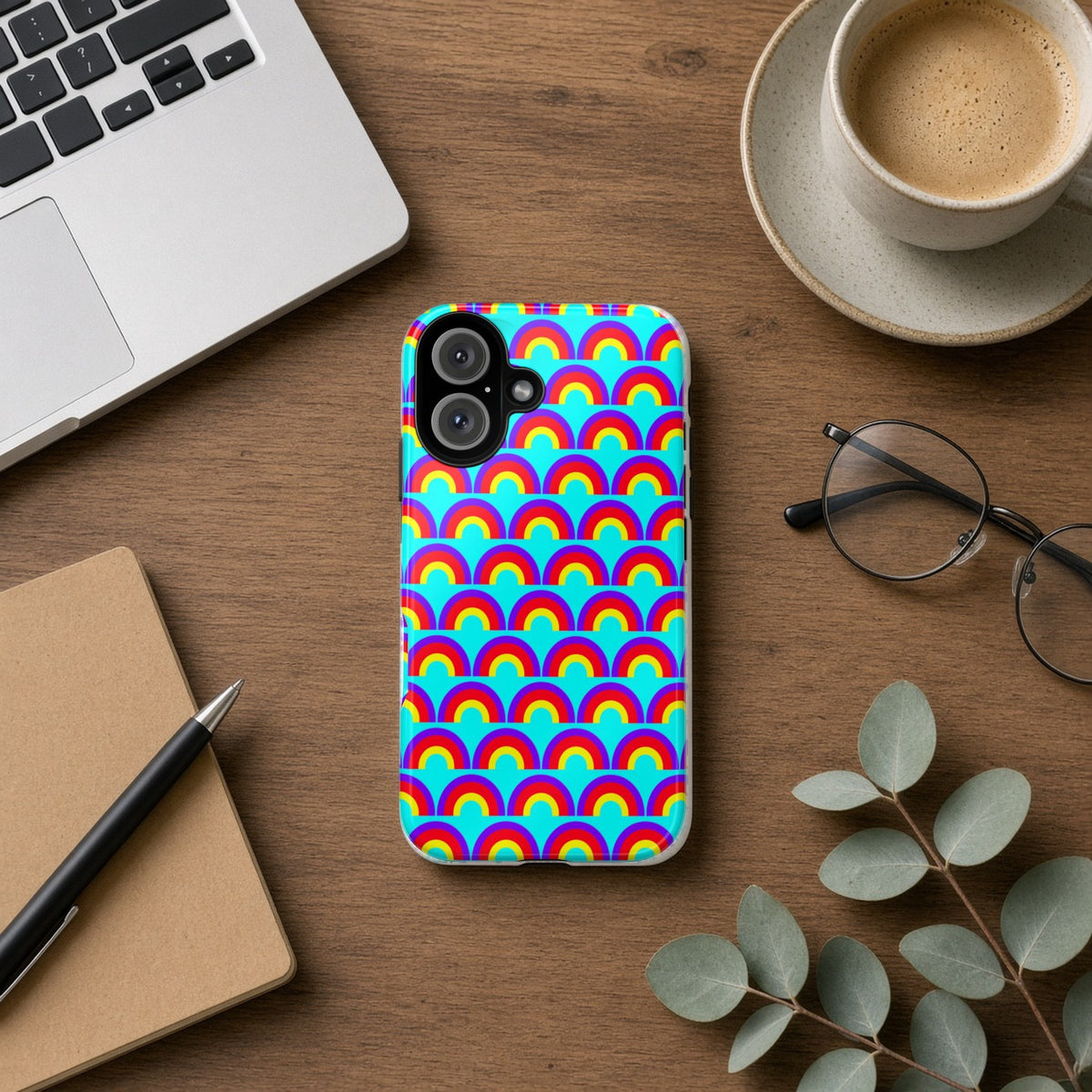 Chromatic Scallop Ripple tough phone case on a wooden desk beside a laptop, coffee and eucalyptus