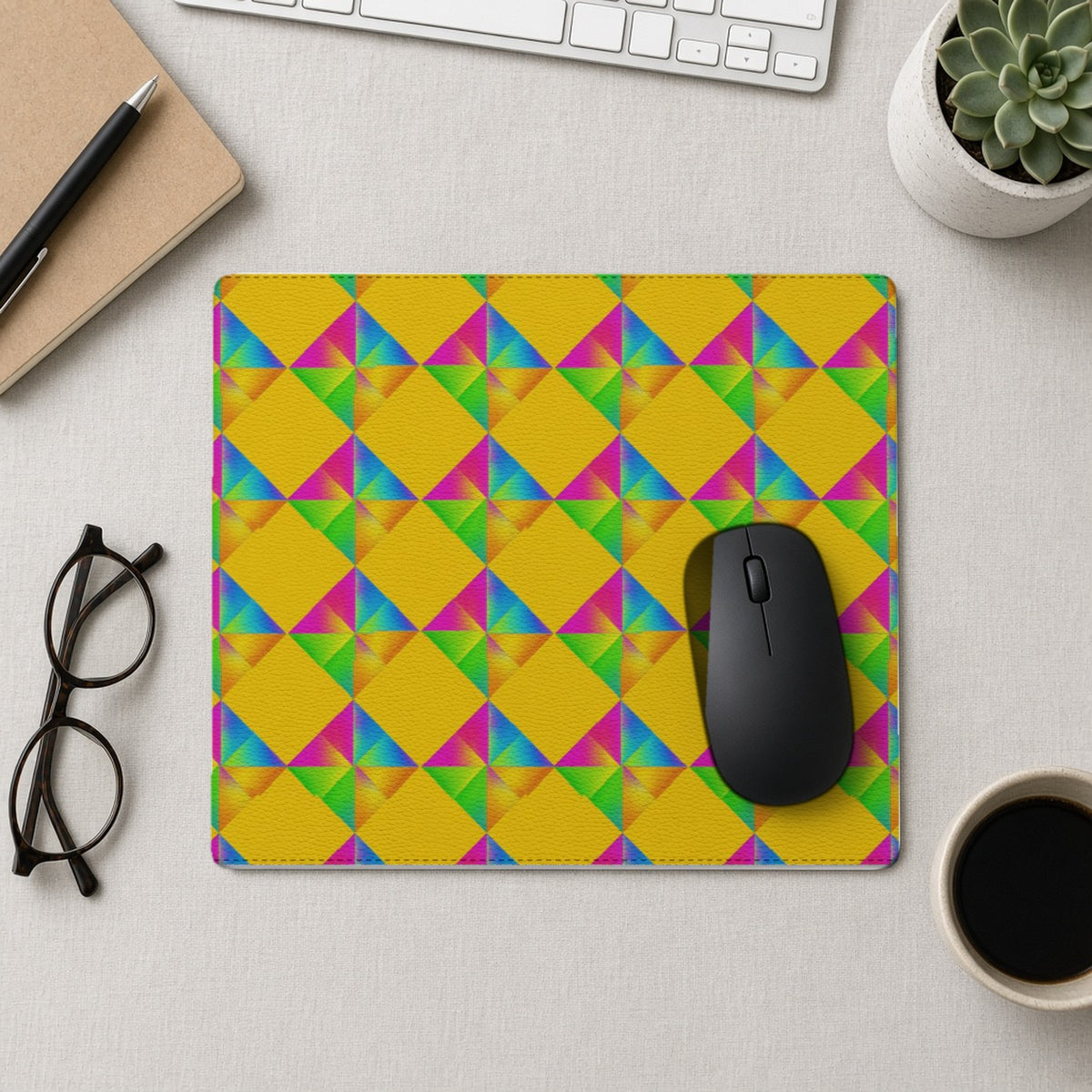 Iridescent Kite Quartet vegan leather mouse mat from above with a mouse, notebook and glasses